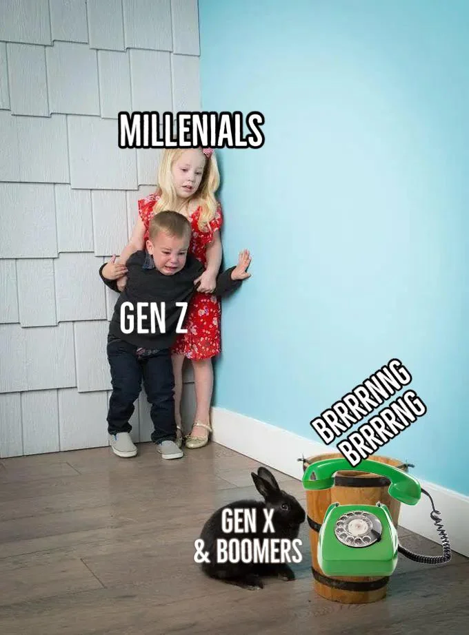 A telephobia meme. Two terrified children, labeled Gen Z and Millenials, are cowering and crying in a corner, while they gaze with horror at a black bunny, labeled Gen X & Boomers sniffing a green rotary phone going "Brrrrrrng Brrrng."